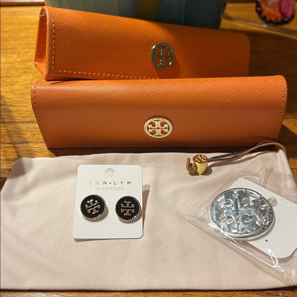 Tory Burch eye glass cases and fashion earrings.